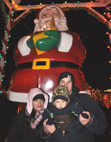 photo:  Scott, Laura, Liam with 15 foot Santa
