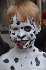 Photo:  Kid painted white with black spots