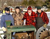 photo:  Men gathered around the ICE CUTTER machine