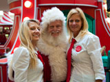 photo:  Santa and two pretty helpers