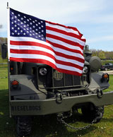 photo:  American flag on military vehicle 