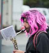 photo:  Alto sax player with purple hair
