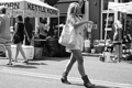 photo:  good lookng woman leaving Starbucks