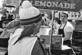 photo:  man with parrot at lemonade stand